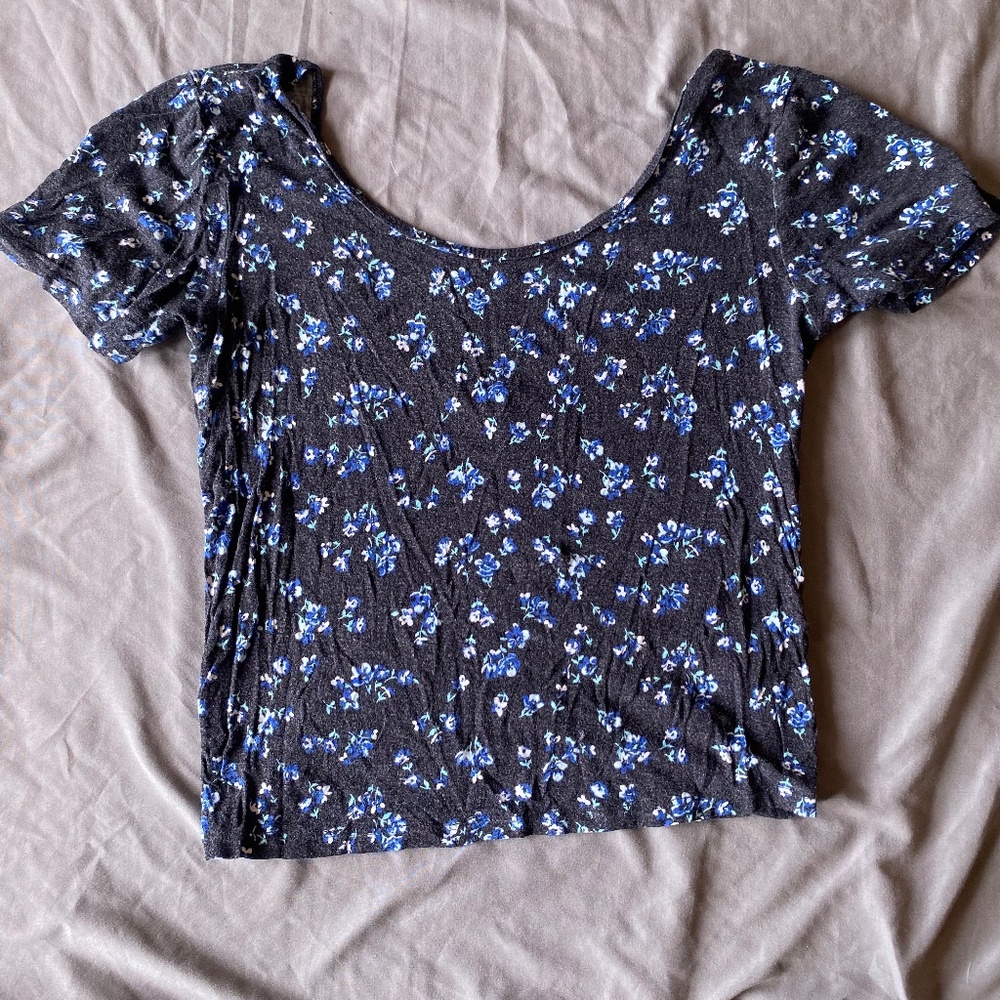 Black crop top with blue floral pattern